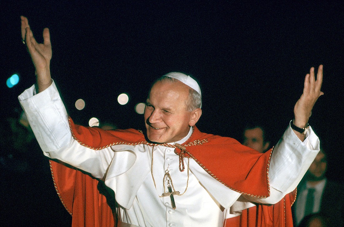 St. John Paul II smiles during a 1980 visit to Paris in this file photo. Relics of the Polish saint have been permanently enshrined in St. Nicholas Roman Catholic Church in Kyiv, Ukraine.