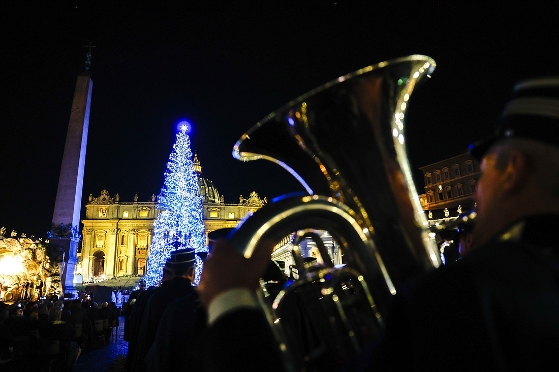 Members of the Vatican Gendarmerie band perform as the Christmas tree is lighted in St. Peter’s Square at the Vatican Dec. 9, 2023. (CNS photo/Lola Gomez)