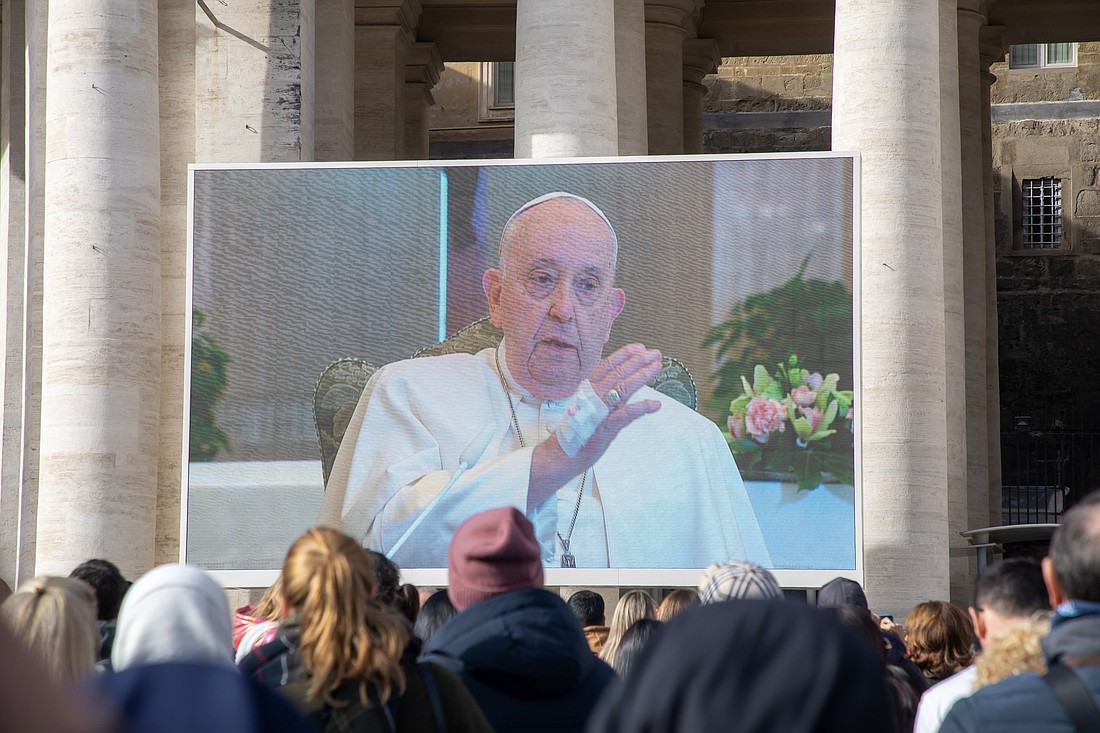 Pope Francis gives his blessing to people gathered in St. Peter's Square at the Vatican and watching a livestream of the Angelus Nov. 26, 2023. The pope did not go to his window overlooking the square because, he said, he had a "problem with inflammation of my lungs." (CNS photo/Pablo Esparza)