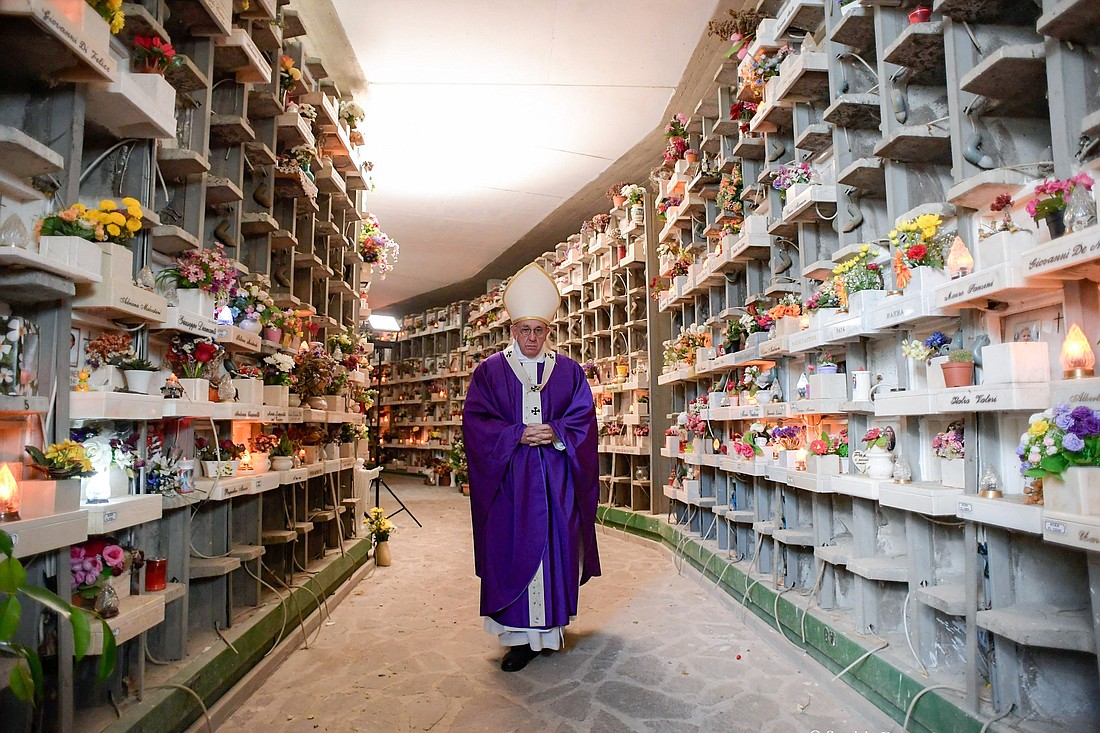 Pope Francis walks through Rome's Prima Porta cemetery in this file photo from Nov. 2, 2016, the feast of All Souls. (CNS photo/L'Osservatore Romano)