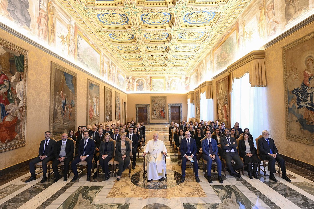 Pope Francis poses for a photo with the staff of the Vatican Secretariat for the Economy in the Apostolic Palace at the Vatican Nov. 13, 2023. He later sent a letter to the staff emphasizing their work as being focused on ensuring resources for the mission of the church. (CNS photo/Vatican Media)