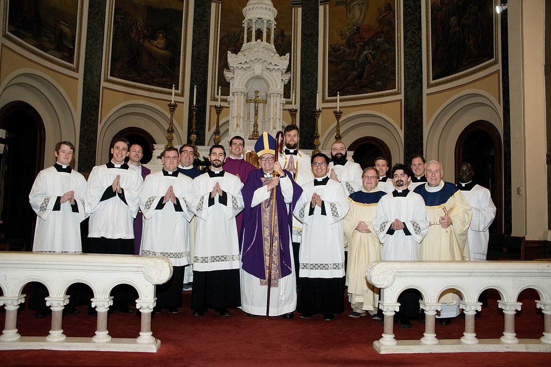 Seminarians of the Diocese pose for a photo with Bishop O'Connell and other priests of the Diocese following the Mass the Bishop celebrated in Sacred Heart Church, Trenton. After the Mass, a dinner followed in the parish rectory. Joe Moore photo