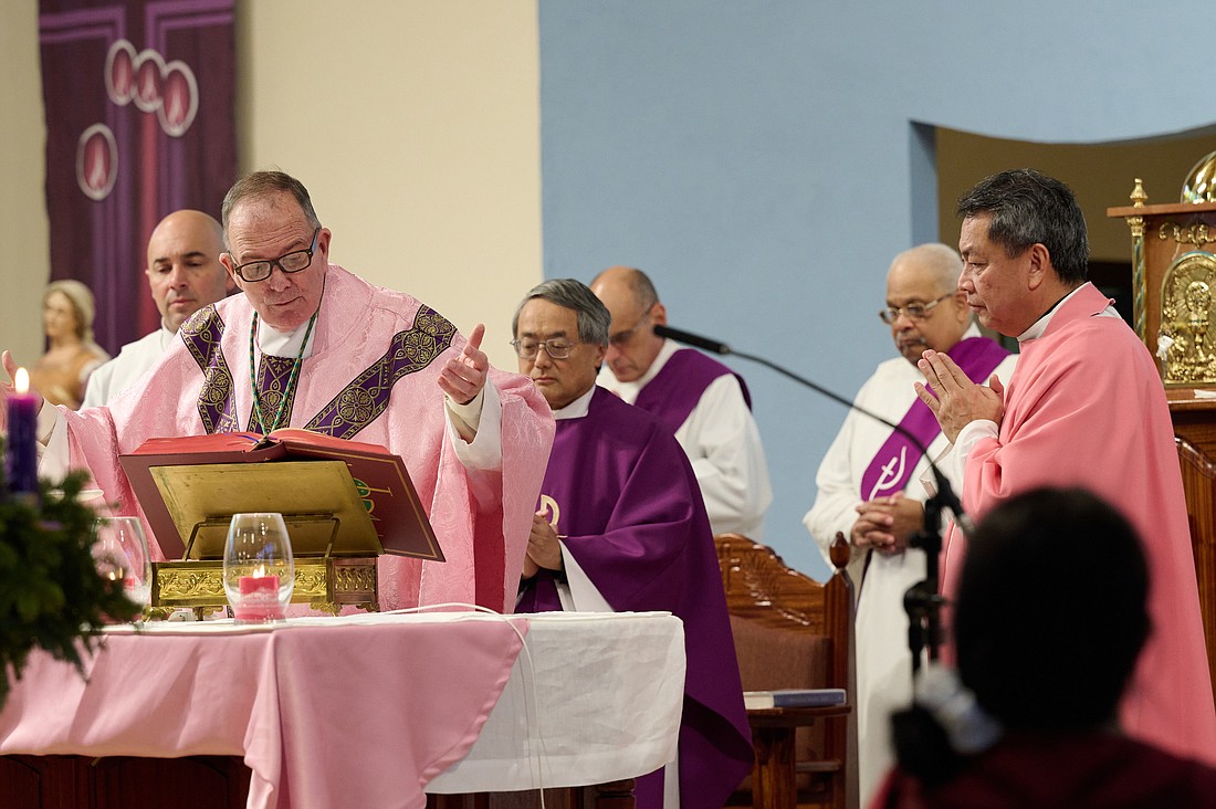 Bishop O'Connell celebrates Mass for the Third Sunday of Advent Dec. 17 in St. Veronica Church, Howell. At right is Father Peter James Alindogan, parish pastor. Mike Ehrmann photo