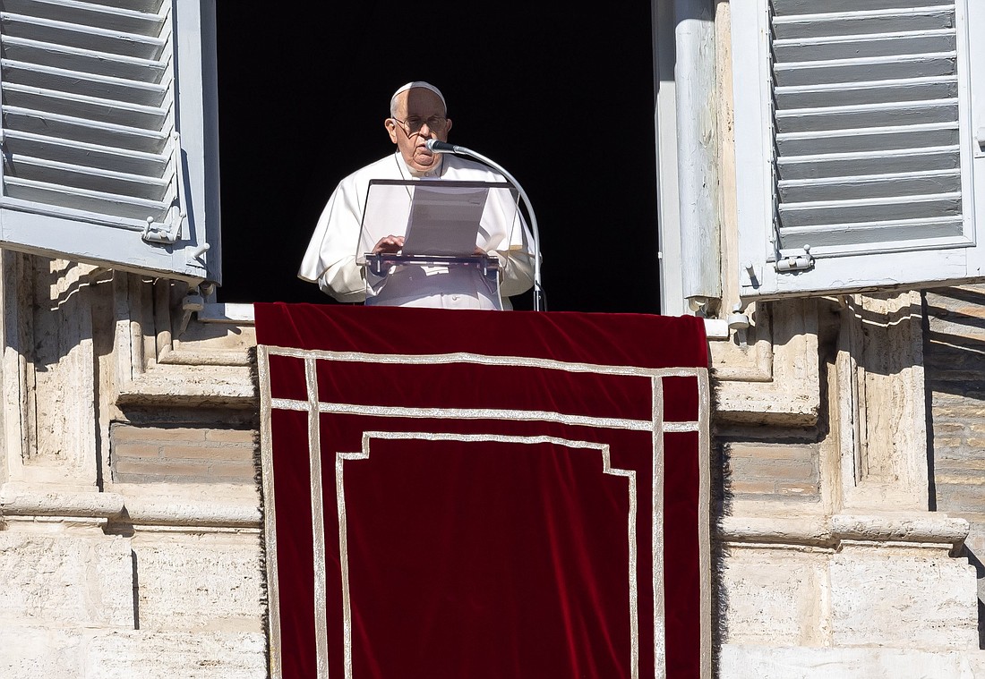 Pope Francis speaks to the crowd gathered in St. Peter's Square at the Vatican to pray the Angelus with him Dec. 17, 2023. (CNS photo/Pablo Esparza)