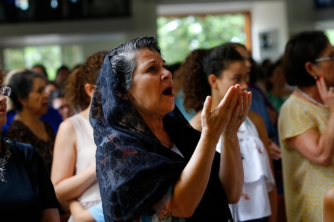 A woman is pictured in a file photo praying during Mass at Divine Mercy Catholic Church in Managua, Nicaragua. Bishop Isidoro Mora of Siuna was arrested Dec. 20, 2023, after voicing spiritual support for imprisoned Bishop Rolando Álvarez of Matagalpa, according to independent Nicaraguan media -- a detention illustrating the country’s unceasing persecution of the Catholic Church and complete closure of all spaces for dissent. (OSV News photo/Oswaldo Rivas, Reuters)