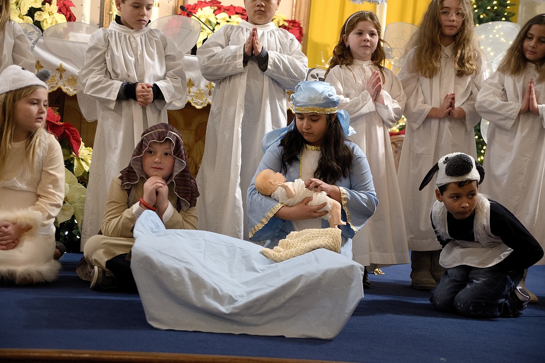 Second grade religious education students presented the Christmas story on Christmas Eve in St. Mary Church, Bordentown. Joe Moore photo