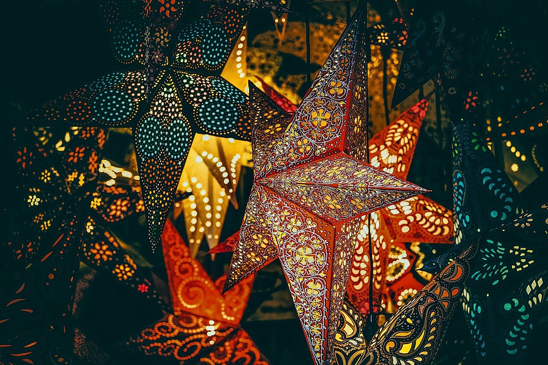 Star lanterns are ablaze in this undated photograph. Bright Christmas and New Year's decorations are worth appreciating through the 12 days of Christmas, notes writer Greg Erlandson. (OSV News photo/Ilo Couleur, Pixabay)