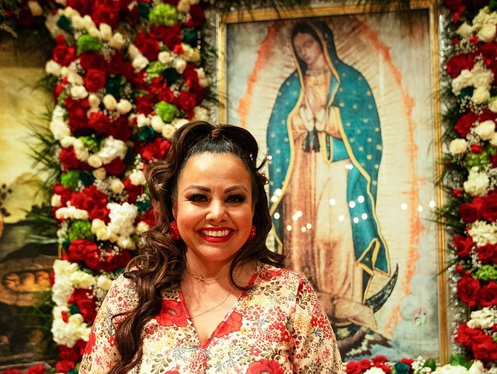 A radiant Rosy Oros stands before an image of Our Lady of Guadalupe at the Cathedral of Our Lady of the Angels in Los Angeles during the annual "Las Mañanitas" celebration Dec. 11-12, 2023, in honor of Our Lady's feast. The singer credits her healing from a deadly infection to the intercession of Our Lady of Guadalupe in 2018. (OSV News photo/Victor Alemán, Angelus)