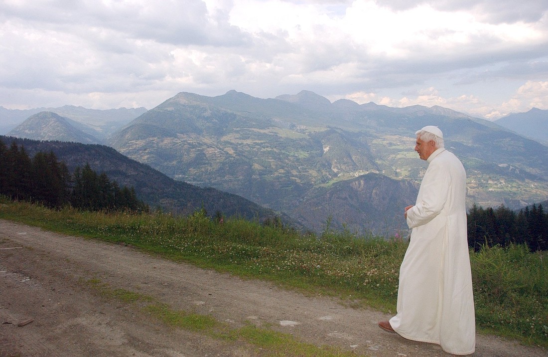 Pope Benedict XVI walks on a path during his summer retreat at Les Combes in the northern mountains of Italy in 2006. (CNS photo/L'Osservatore Romano)