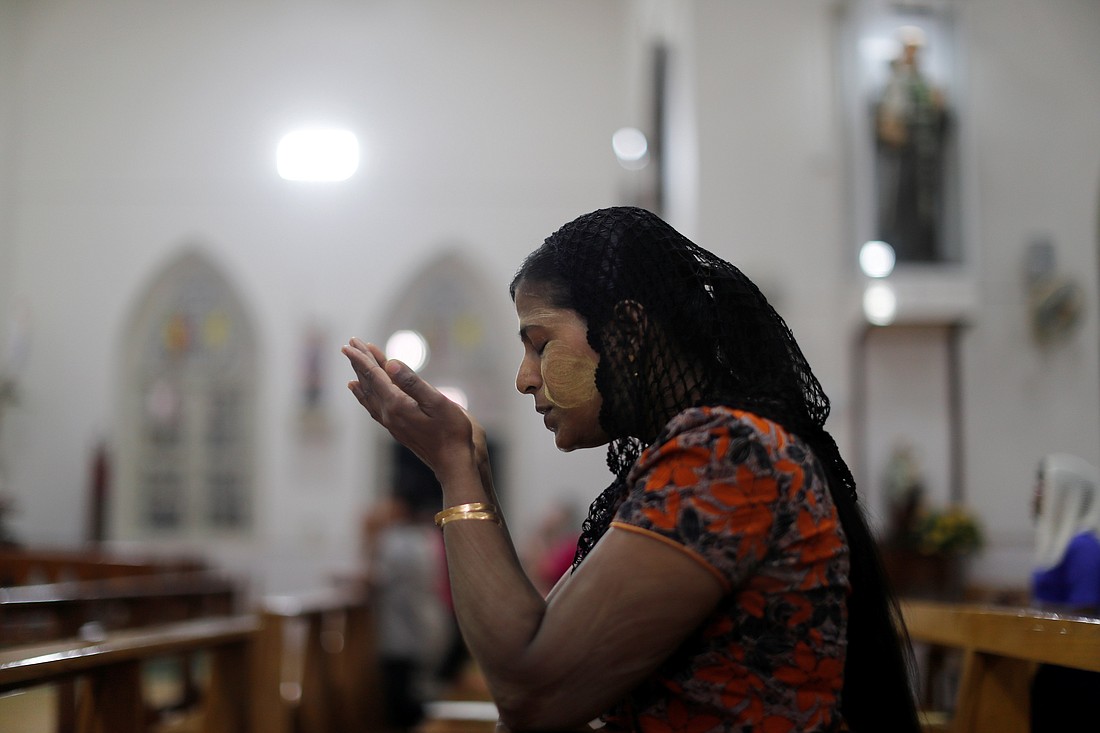 A woman is pictured in a file photo praying at St. Anthony Church in Yangon, Myanmar. According to a 2023 report released by Aid to the Church in Need, Christian persecution is on the rise globally, including in Myanmar, but that repression remains largely overlooked in the news cycle, one expert told OSV News. (OSV News photo/Jorge Silva, Reuters)..