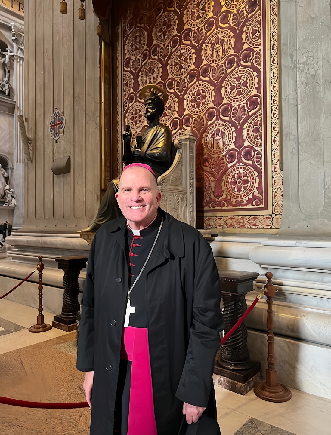 Bishop O'Connell stands in front of the Chair of St. Peter in St. Peter Basilica, Rome Jan. 2. On Jan. 4, the Bishop will begin to lead a pilgrimage for 20 priests of the Diocese and two diocesan staff. Staff photo