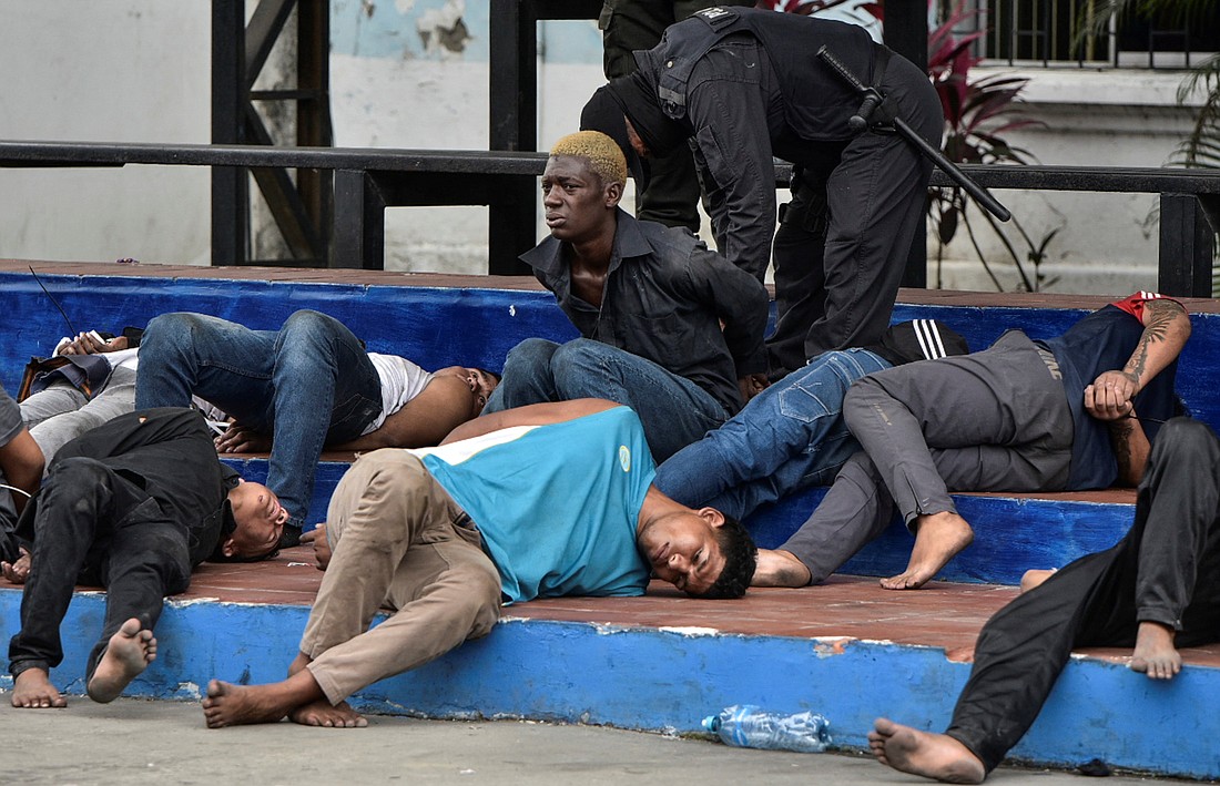 Police officers present the detainees who stormed the TC Television studio during a live TV broadcast during a wave of violence around the nation, in Guayaquil, Ecuador, Jan. 10, 2024. (OSV News photo/Vicente Gaibor del Pino, Reuters)