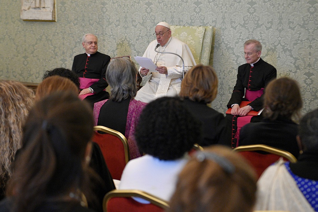 Pope Francis reads his speech to a delegation representing the "Sentinelles de la Sainte Famille" (Sentinels of the Holy Family), an association of laywomen dedicated to the Holy Family and prayer, during an audience at the Vatican Jan. 11, 2024. (CNS photo/Vatican Media)