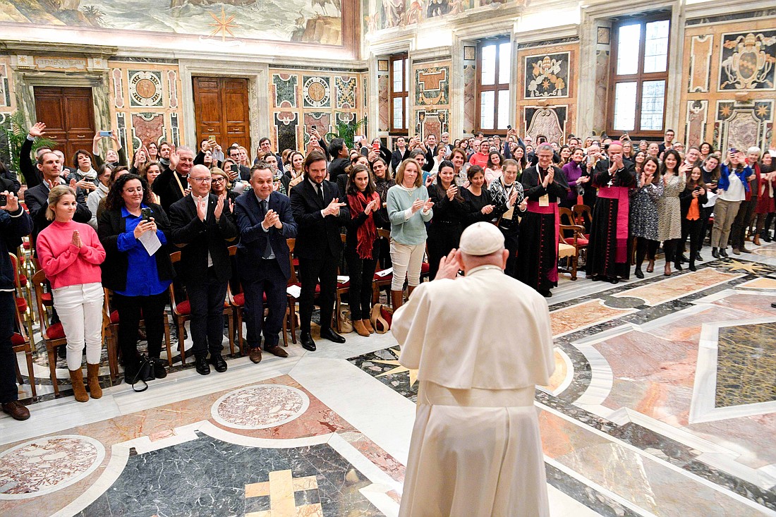 Pope Francis waves to communications representatives of dioceses, religious congregations, parishes and other Catholic groups in France during an audience at the Vatican Jan. 12, 2024. (CNS photo/Vatican Media)