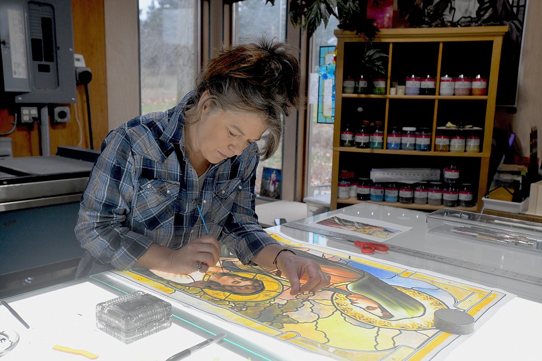 Minnesota stained-glass artist Christi Becker works on a stained-glass window in her studio in this undated photo. (OSV News photo/Dianne Towalski, The Central Minnesota Catholic)