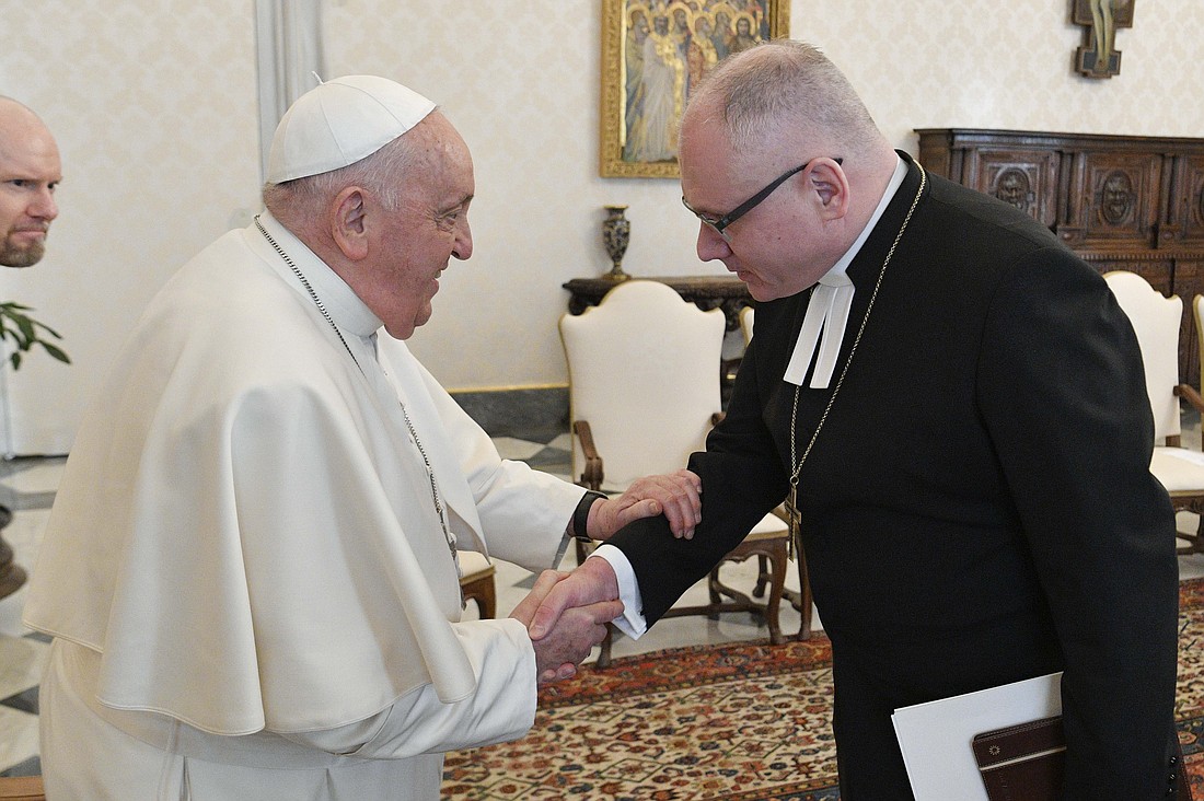 Pope Francis greets Lutheran Bishop Bo-Göran Åstrand of Porvoo, leader of an ecumenical pilgrimage from Finland, during an audience Jan. 19, 2024, in library of the Apostolic Palace at the Vatican. (CNS photo/Vatican Media)