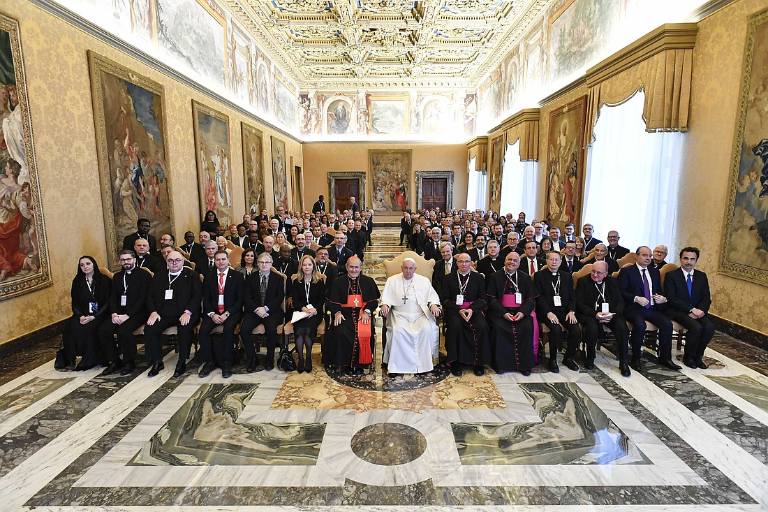 Pope Francis poses for a photo with university chancellors, rectors and other leaders of Catholic institutions belonging to the International Federation of Catholic Universities after an audience in the Apostolic Palace at the Vatican Jan. 19, 2024. Cardinal José Tolentino de Mendonça, prefect of the Dicastery for Culture and Education, is seen to the left of the pope. (CNS photo/Vatican Media)