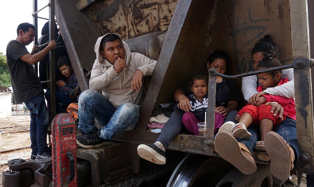 Central American migrants, moving in a caravan through Juchitan, Mexico, are pictured in a file photo on a train during their journey toward the United States. (OSV News photo/Jose de Jesus Cortes, Reuters)