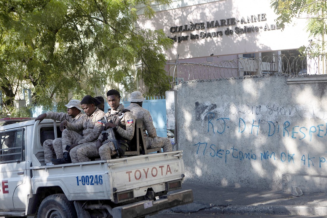 Haitian National Police patrol outside the College Marie-Anne in Port-au-Prince Jan. 22, 2024, days after six nuns were kidnapped by armed men while sisters were traveling on a bus. The nuns, who have since been freed, were abducted, along with other passengers on a bus, are members of the Sisters of St. Anne, the congregation that runs the college. (OSV News photo/Ralph Tedy Erol, Reuters)