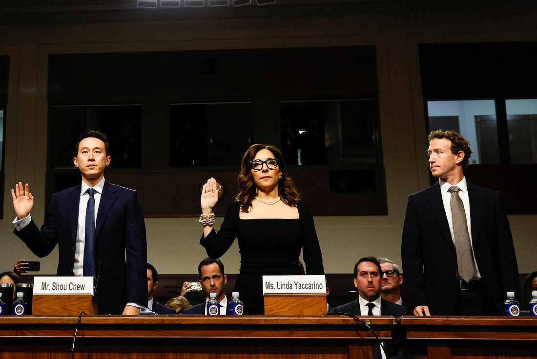 Meta's CEO Mark Zuckerberg looks at X Corp.'s CEO Linda Yaccarino and TikTok's CEO Shou Zi Chew as they raise their hands to be sworn in during the Senate Judiciary Committee hearing on online child sexual exploitation at the U.S. Capitol in Washington Jan. 31, 2024. (OSV News photo/Evelyn Hockstein, Reuters)