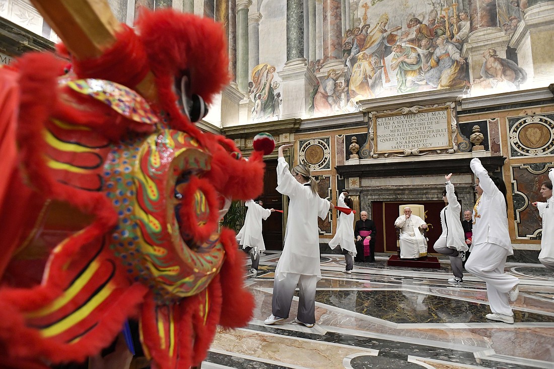 Acrobats from the Chinese Martial Arts Academy of Vercelli in northern Italy perform for Pope Francis during an audience at the Vatican Feb. 2, 2024. The audience included a delegation from the academy and the National Federation Italy-China to mark the 10th anniversary of the federation and prepare for the Chinese New Year, which begins Feb. 10. (CNS photo/Vatican Media)