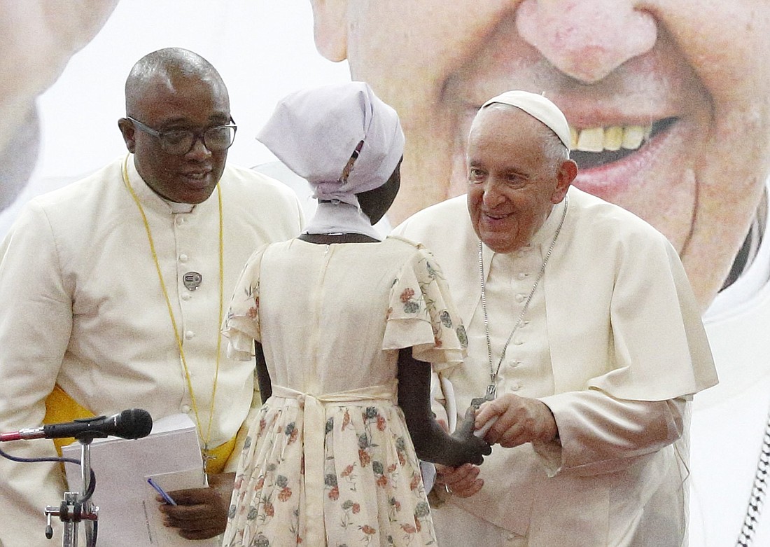 Pope Francis greets Nyakuor Rebecca during a meeting with internally displaced people at Freedom Hall in Juba, South Sudan, Feb. 4, 2023. (CNS photo/Paul Haring)