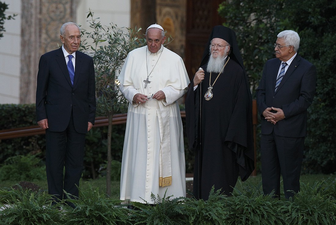 Israeli President Shimon Peres, Pope Francis, Orthodox Ecumenical Patriarch Bartholomew of Constantinople and Palestinian President Mahmoud Abbas attend an invocation for peace in the Vatican Gardens June 8, 2014. (CNS photo/Paul Haring)