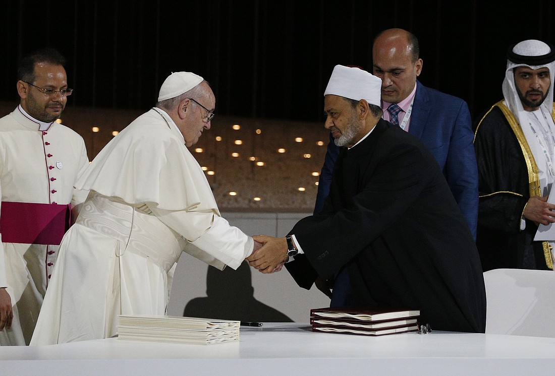 Pope Francis shakes hands with Sheik Ahmad el-Tayeb, grand imam of Egypt's al-Azhar mosque and university, during a document signing at an interreligious meeting at the Founder's Memorial in Abu Dhabi, United Arab Emirates, Feb. 4, 2019. (CNS photo/Paul Haring) See POPE-UAE-DIALOGUE Feb. 4, 2019.