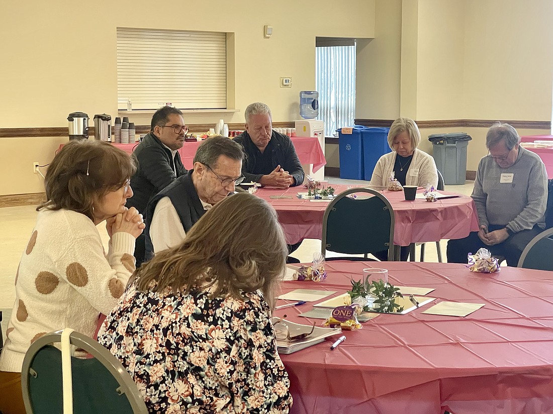 Pastors and parish representatives begin the ACA information session in prayer Feb. 1 in St. Catherine of Siena Parish, Farmingdale.
Staff photo