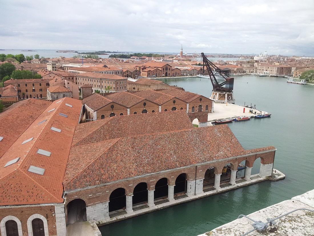 The bell tower of St. Mark's Basilica in Venice, Italy, can be seen in the distance from the Venetian Arsenal, a complex of former shipyards and armories, in this 2015 file photo. Today, the arsenal hosts the Venice Biennale, a major international contemporary art exhibition. (CNS photo/courtesy Venice Biennale)