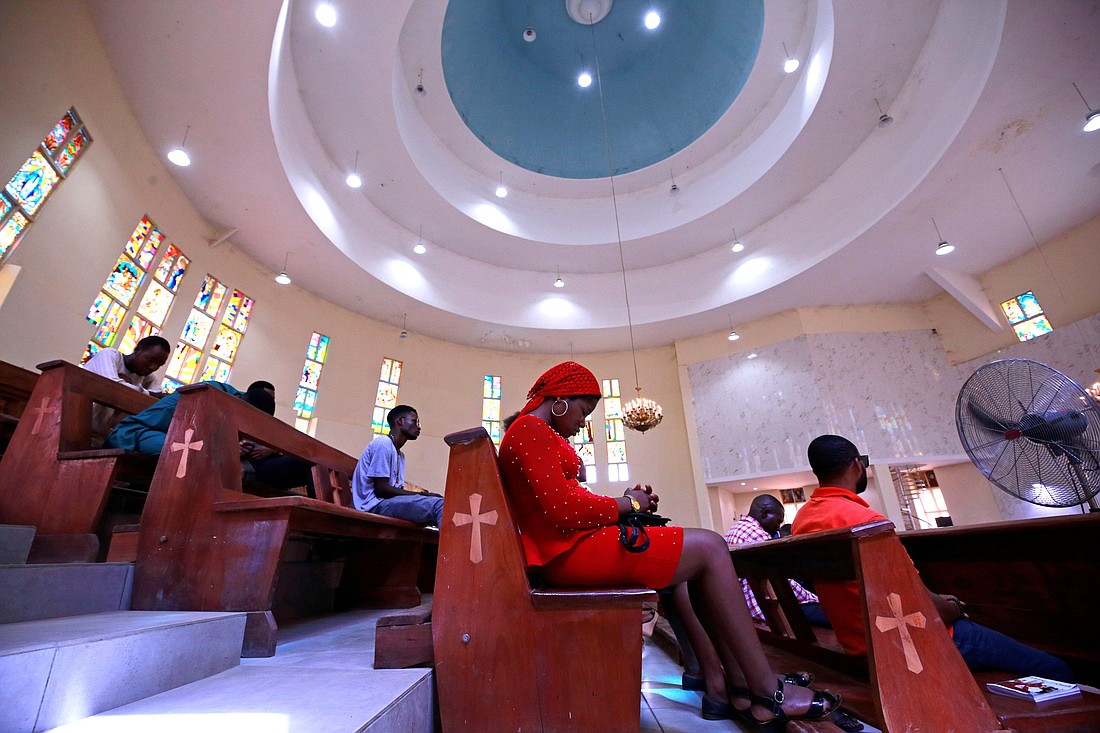 Worshippers are pictured in a file photo praying during Mass at St. Gabriel Catholic Church in Abuja, Nigeria. A report published in early 2023 shows that the Mass attendance rate in Nigeria is one of the highest in the world, but at the same time the nation's persecution of Christians and other non-Muslims ranks among the worst on the planet. The Open Doors organization reported that 90% of the more than 5,600 Christians killed for their faith in 2023 were from Nigeria. (CNS photo/Afolabi Sotunde, Reuters)