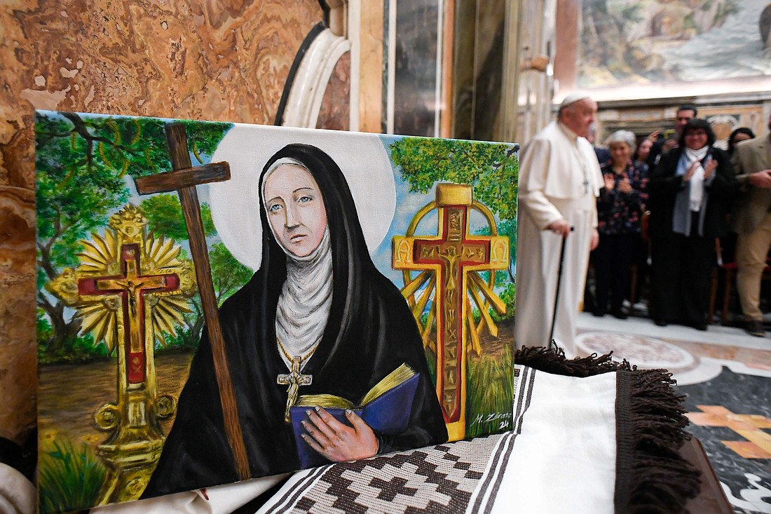 A painting of Blessed María Antonia de Paz Figueroa, known as "Mama Antula," is displayed during a meeting between Pope Francis and Argentine pilgrims at the Vatican Feb. 9, 2024,  ahead of the canonization of Argentina's first female saint. (CNS photo/Vatican Media)