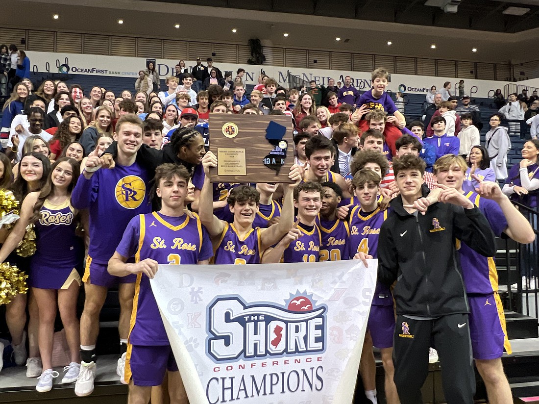 The St. Rose, Belmar boys basketball team celebrates its first-ever Shore Conference Tournament championship after a convincing win over Manasquan at Monmouth University Feb. 18. Courtesy photo