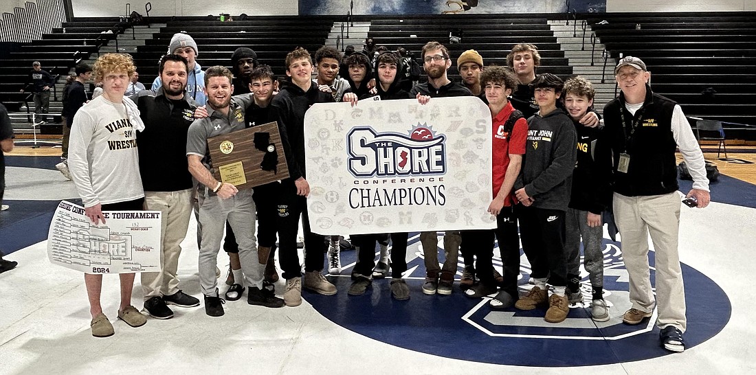 The St. John Vianney wrestling team proudly displays its Shore Conference Tournament championship banner, which is its first since 2018 and second in program history. Courtesy photo