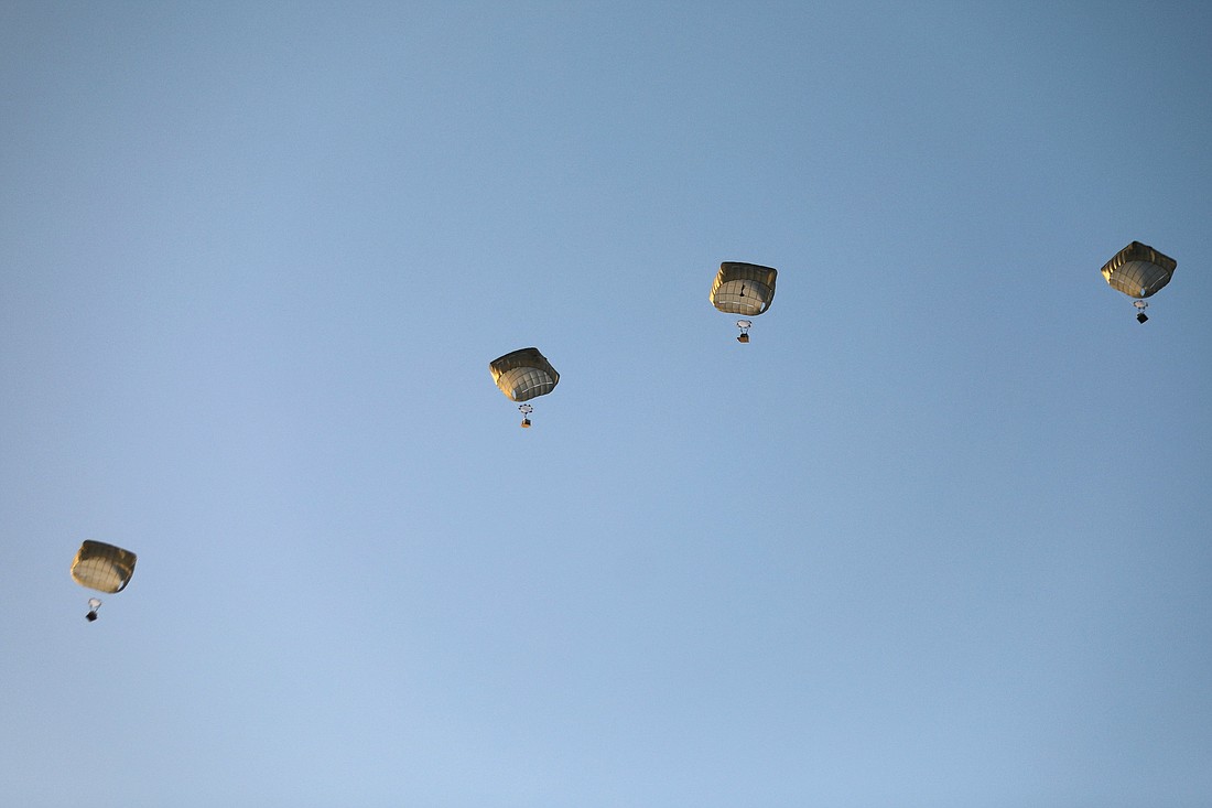 The U.S. military carries out its first aid drop over Gaza City March 2, 2024, amid the ongoing the conflict between Israel and the Palestinian Islamist group Hamas. (OSV News photo/Kosay Al Nemer, Reuters)