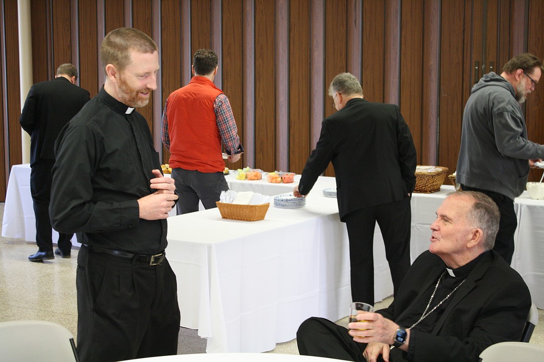 Bishop O'Connell takes time to chat with Father James O'Neill, pastor of St. John Parish, Lakehurst, during the Lenten Spirituality Day for Priests. Trey Taylor-Norwood photo