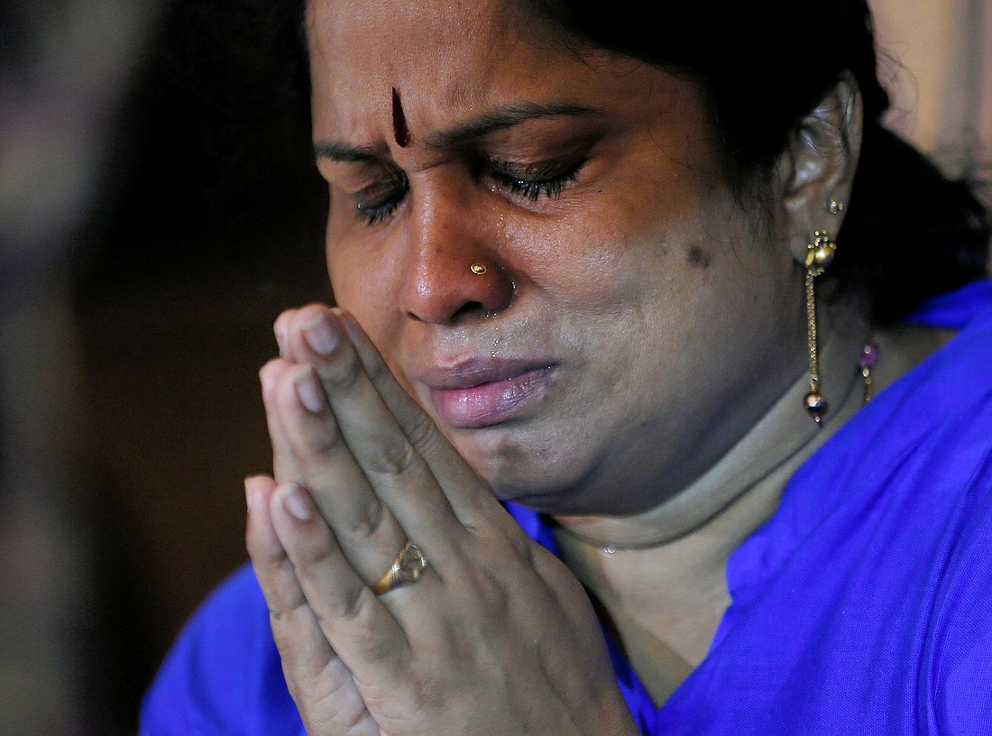 A family member of victims cries while praying during the reopening ceremony of St. Anthony's Shrine in Colombo, Sri Lanka, June 12, 2019, months after it was closed because of an Easter bombing. Persecuted Catholics and other Christians in Sri Lanka and around the globe receive spiritual and material aid from the pontifical foundation Aid to the Church in Need. (OSV News photo/Dinuka Liyanawatte, Reuters)