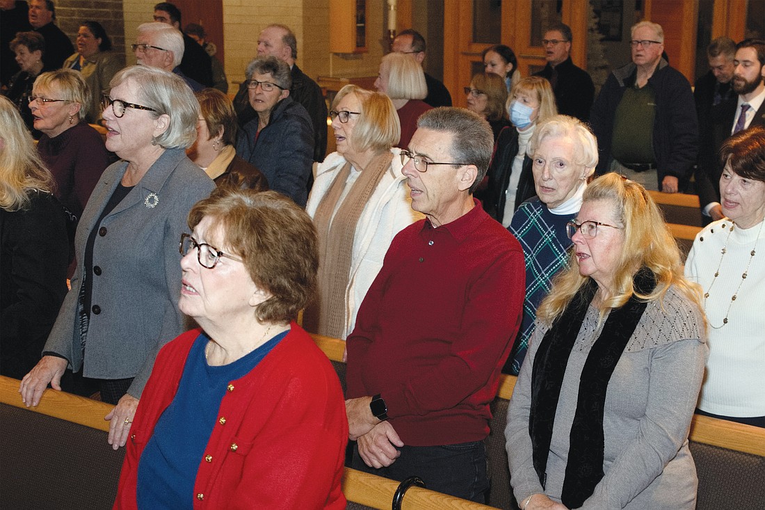 Parishioners join in song in St. Luke Church, Toms River. Hal Brown photo