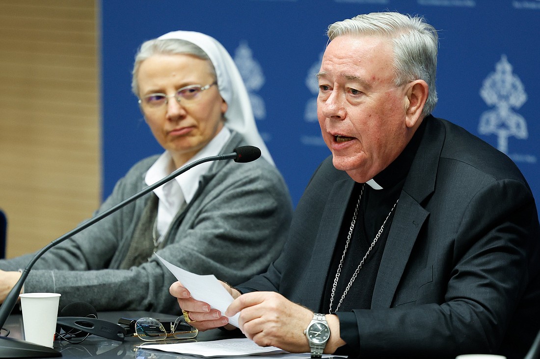 Cardinal Jean-Claude Hollerich, relator general of the synod on synodality, speaks during a news conference at the Vatican March 14, 2024, about study groups authorized by Pope Francis to examine issues raised at the synod. Looking on is Consolata Missionary Sister Simona Brambilla, secretary of the Dicastery for the Institutes of Consecrated Life and the Societies of Apostolic Life. (CNS photo/Lola Gomez)