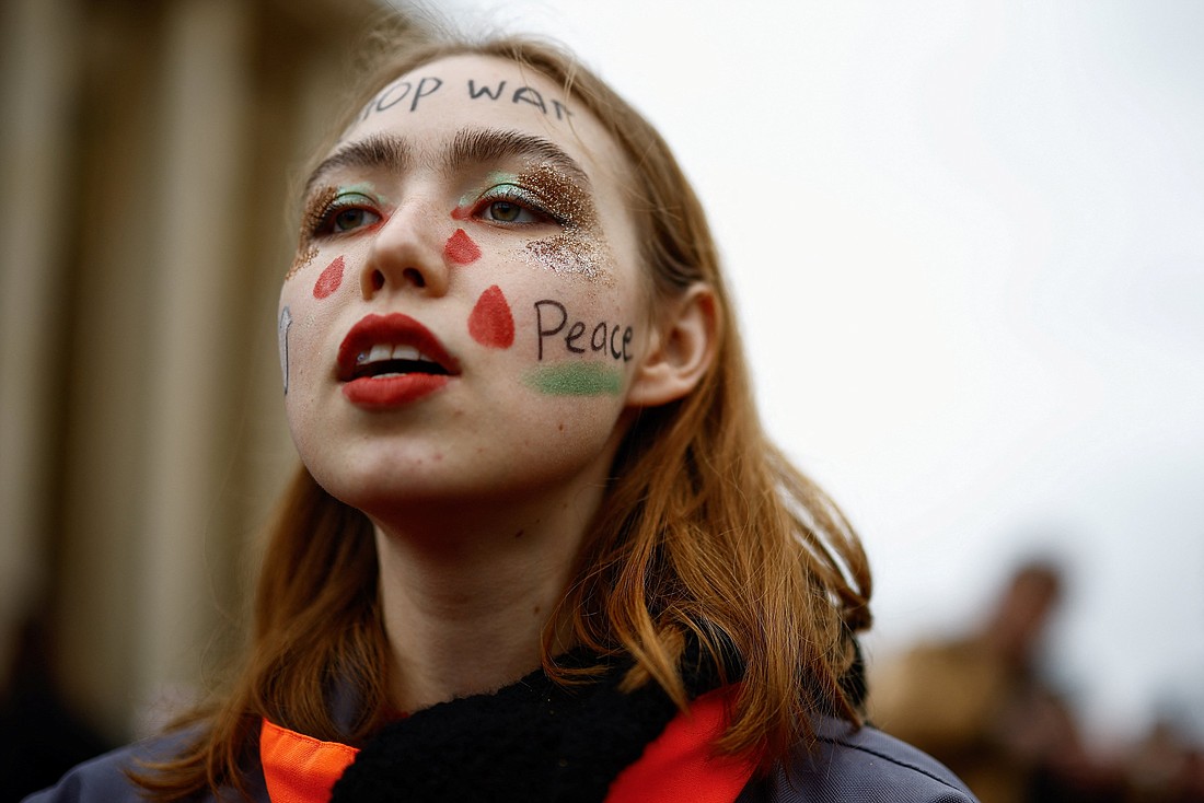 A demonstrator attends a protest at Place du Trocadero in Paris March 17, 2024, against the reelection of Russia's incumbent President Vladimir Putin on the final day of the march 15-17 presidential election in Russia. (OSV News photo/Sarah Meyssonnier, Reuters)