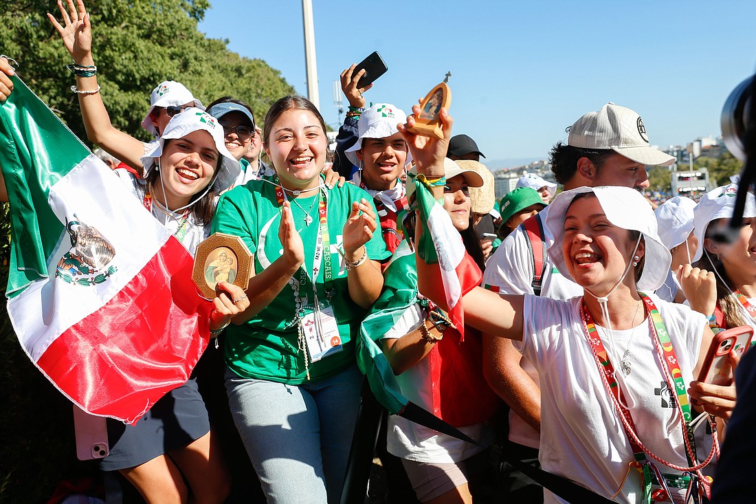 Young people from Mexico celebrate as they wait for Pope Francis to arrive at the World Youth Day welcome ceremony at Eduardo VII Park in Lisbon, Portugal, Aug. 3, 2023. (CNS photo/Lola Gomez)