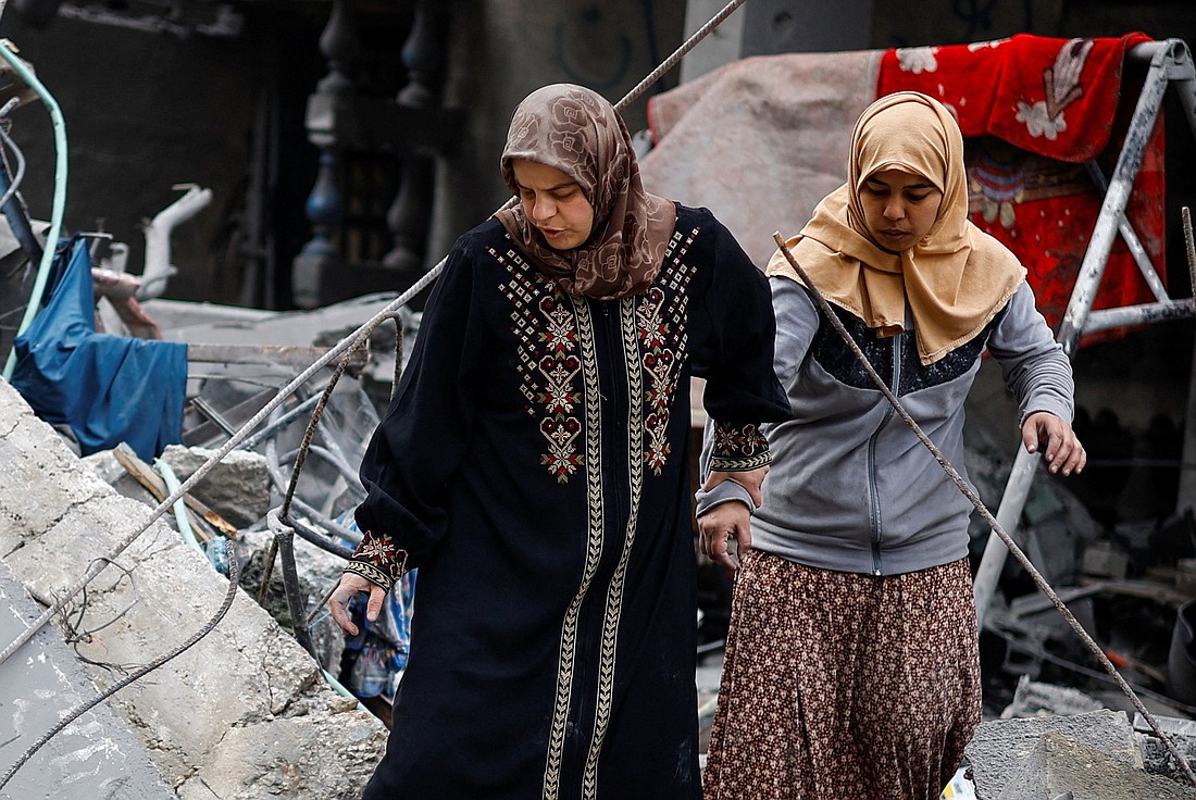 Palestinians inspect the site of an an Israeli airstrike on a house, amid the ongoing conflict between Israel and the Palestinian Islamist group Hamas, in Rafah, in the southern Gaza Strip, March 24, 2024. (OSV News photo/Mohammed Salem, Reuters)