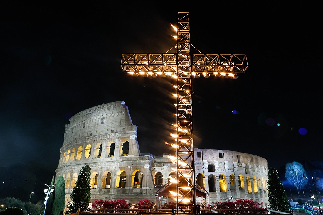 A large illuminated cross is displayed before the start of the Way of the Cross outside the Colosseum in Rome March 29, 2024. (CNS photo/Lola Gomez)