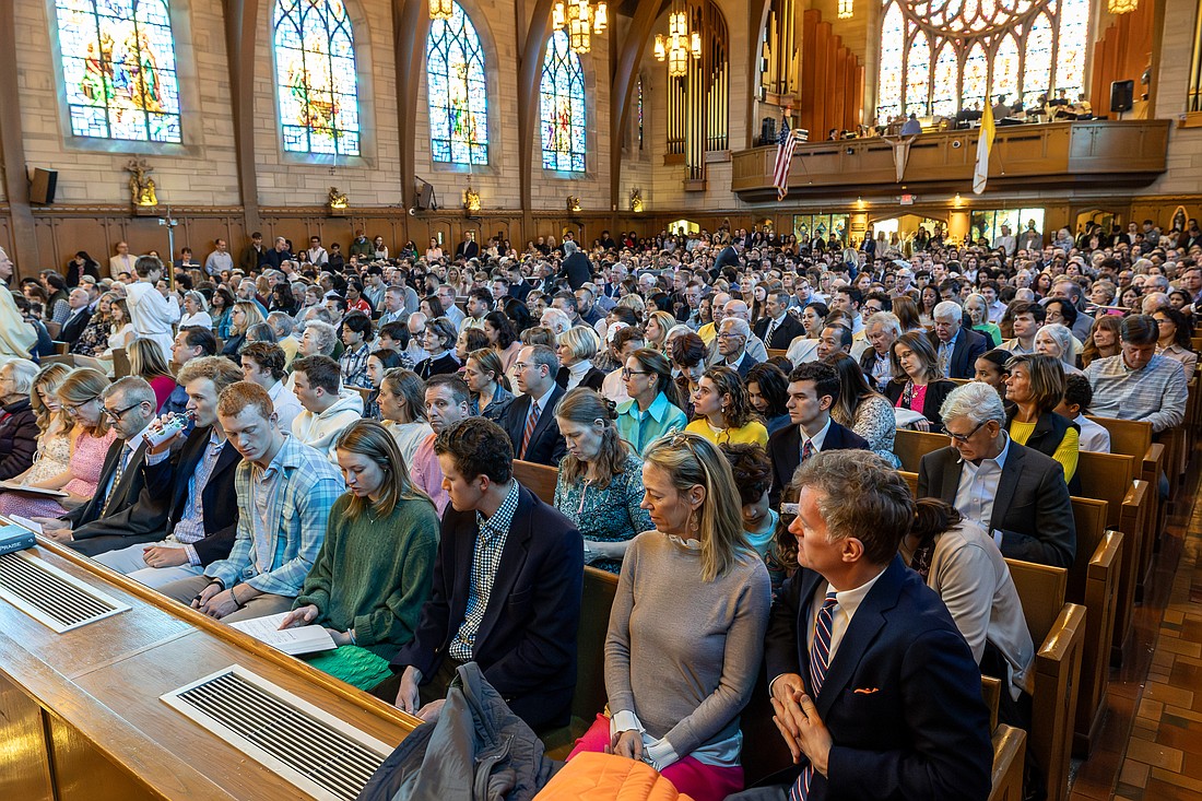 A packed congregation gathers for Easter Sunday Mass in St. Paul Church, Princeton. Hal Brown photo