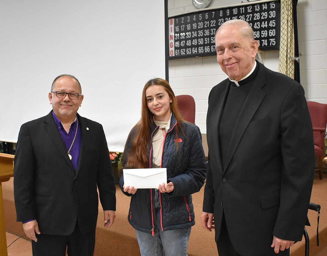 Msgr. Crean Scholarship winner Luisa Bolonas Vega pauses at the award breakfast for a photo with Wilfredo Serrano, scholarship committee chair, and Msgr. John K. Dermond, moderator of the Federation of Mercer County Holy Name Societies. Courtesy photo