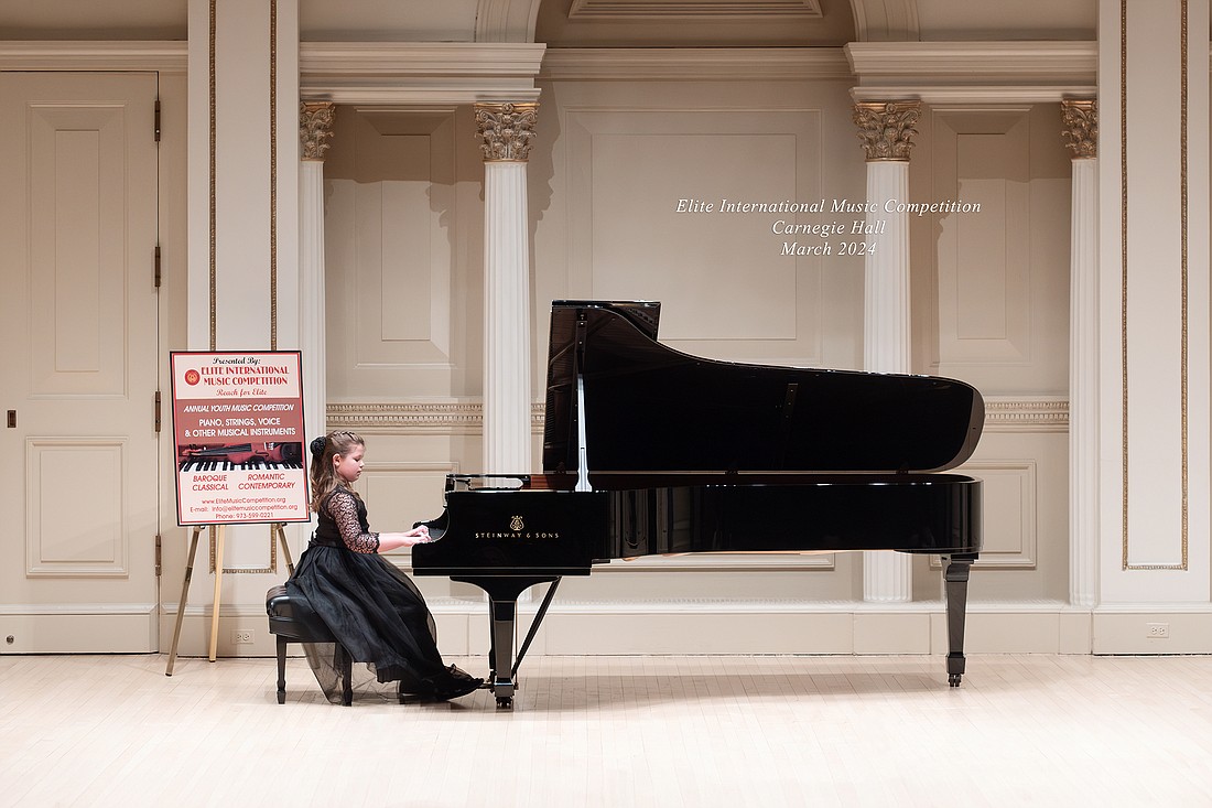 Third-grader Kotryna Vaivilavicius performs in Carnegie Hall in the Elite International Music Competition. Courtesy photo