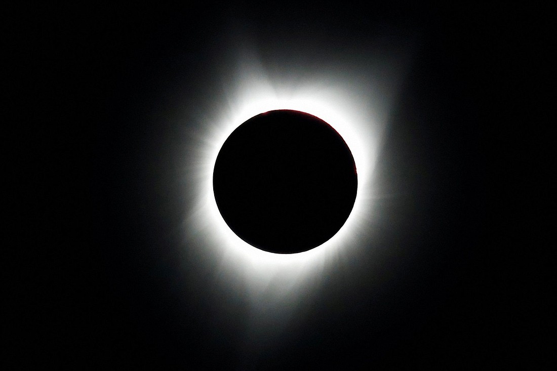 A total solar eclipse is photographed from atop Carroll Rim Trail at Painted Hills, a section of the John Day Fossil Beds National Monument, near Mitchell, Ore., Aug. 21, 2017. A total solar eclipse, dubbed "The Great North American Eclipse," takes place April 8, 2024, and the next such eclipse visible in the U.S. will happen in August 2044. (OSV News photo/Adrees Latif, Reuters)