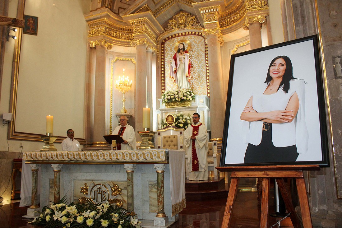 A framed photo of Gisela Gaytán Gutiérrez, candidate for the ruling party Morena who was running for mayor of Celaya, Mexico, is seen during her funeral Mass April 3, 2024, at Immaculate Conception Cathedral in Celaya in the state of Guanajuato, northwest of Mexico City. She was killed April 1 by unknown assailants. (OSV News photo/Juan Moreno, Reuters)