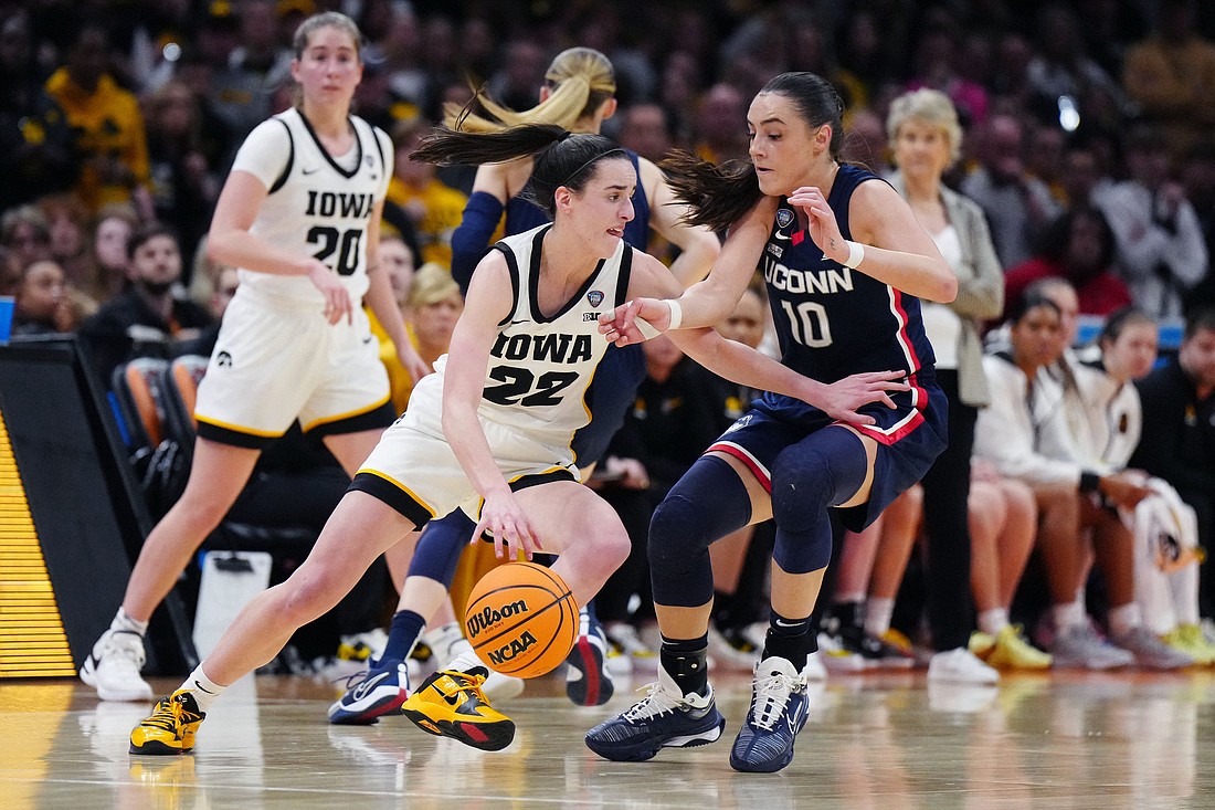 Iowa Hawkeyes guard Caitlin Clark (22) controls the ball against Connecticut Huskies guard Nika Muhl (10) in the Final Four of the women’s 2024 NCAA Tournament at Rocket Mortgage FieldHouse in Cleveland April 5, 2024. The Hawkeyes beat the Huskies to advance to the women's NCAA tournament national championship game April 6 against undefeated South Carolina. Clark graduated in 2020 from Dowling Catholic High School in West Des Moines, Iowa. OSV News photo/Mandatory Credit: Kirby Lee-USA TODAY Sports via Reuters