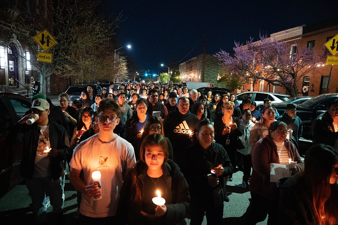 Hundreds walk the streets of Baltimore April 8, 2024, in a candlelit procession following a prayer service at Sacred Heart of Jesus/Sagrado Corazón de Jesús in memory of the six crewmen who perished in the Francis Scott Key Bridge collapse. (OSV News photo/Kevin J. Parks, Catholic Review)